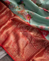 Stunning Floral Kanchi saree in a sea green red combo