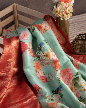 Stunning Floral Kanchi saree in a sea green red combo