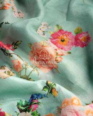 Stunning Floral Kanchi saree in a sea green red combo