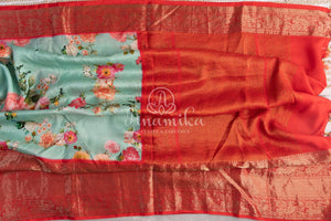 Stunning Floral Kanchi saree in a sea green red combo
