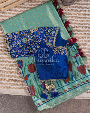 Blue Kanchipattu saree with floral prints border and pallu