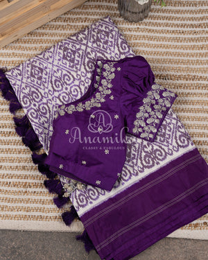 Off white and Purple Ikkat silk saree in a contemporary print