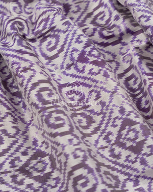 Off white and Purple Ikkat silk saree in a contemporary print