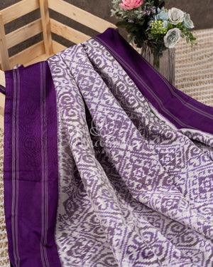 Off white and Purple Ikkat silk saree in a contemporary print