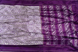 Off white and Purple Ikkat silk saree in a contemporary print