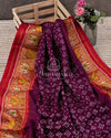 Pure silk Plum color Bandini saree with a contrast red handwoven patola border
