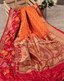 Pure Banarasi Silk Saree with a multi color floral border - orange/red combo
