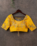 Yellow blouse with multi color thread embroidery