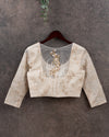 Off white chikankari blouse with net back and pearl work