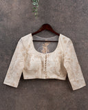 Off white chikankari blouse with net back and pearl work