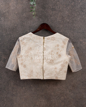 Off white chikankari blouse with net sleeves and pearl work
