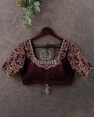 Orange Banarasi Kora Saree with meenakari floral border paired with a contrast brown blouse