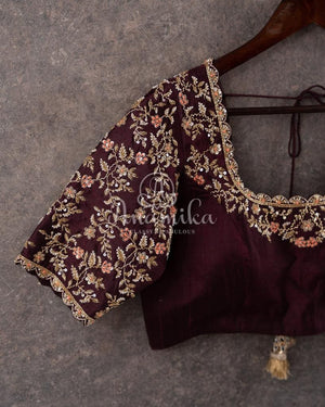 Orange Banarasi Kora Saree with meenakari floral border paired with a contrast brown blouse