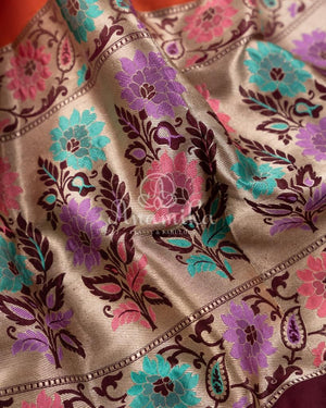 Orange Banarasi Kora Saree with meenakari floral border paired with a contrast brown blouse