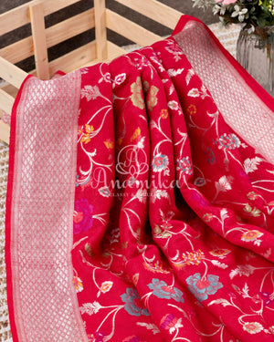 Red Tusser Georgette saree with all over floral jaal, paired with a contrast green blouse