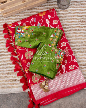 Red Tusser Georgette saree with all over floral jaal, paired with a contrast green blouse