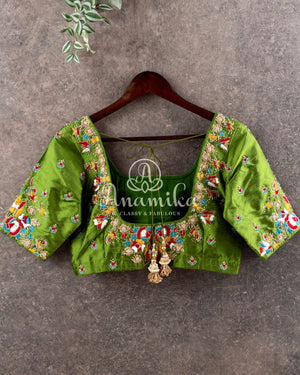 Red Tusser Georgette saree with all over floral jaal, paired with a contrast green blouse