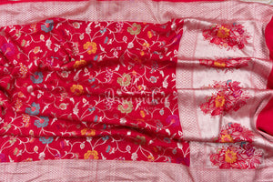 Red Tusser Georgette saree with all over floral jaal, paired with a contrast green blouse