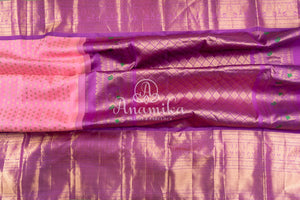 Royal Kanchi Gadwal saree paired with a contrast purple handwork blouse