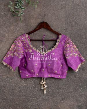 Royal Kanchi Gadwal saree paired with a contrast purple handwork blouse