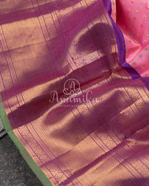Royal Kanchi Gadwal saree paired with a contrast purple handwork blouse