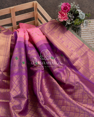 Royal Kanchi Gadwal saree paired with a contrast purple handwork blouse