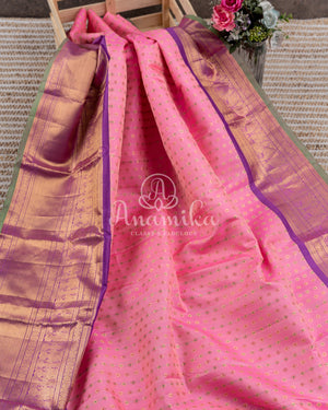 Royal Kanchi Gadwal saree paired with a contrast purple handwork blouse