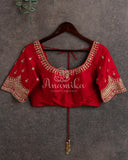 Mehendi Green Kora Jamdaani paired with a stunning red scallop work blouse