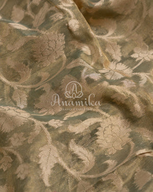 Mehendi Green Kora Jamdaani paired with a stunning red scallop work blouse