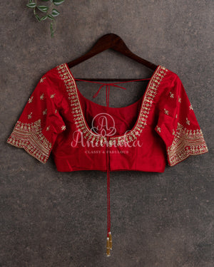 Mehendi Green Kora Jamdaani paired with a stunning red scallop work blouse