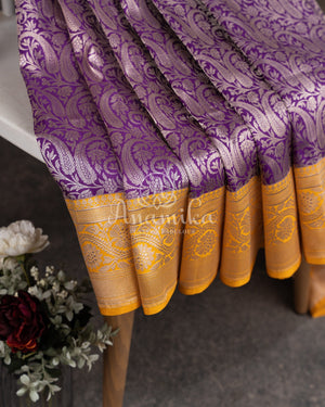 Royal Purple Banarasi saree with a graceful yellow border