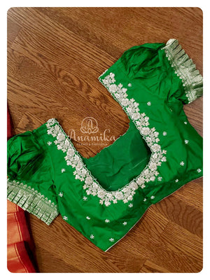 Black Ikkat Patola Saree with Green Puff sleeves blouse