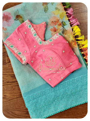 Pastel Blue Organza saree with pink handworked blouse