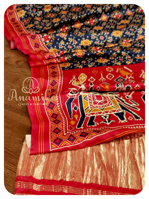 Blue satin patola saree with red handworked blouse