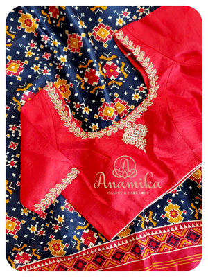 Blue satin patola saree with red handworked blouse