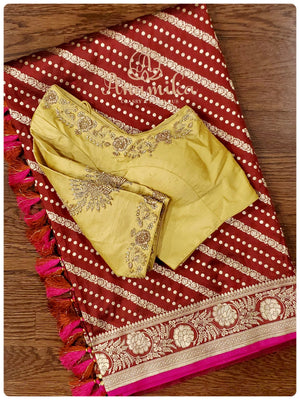 Maroon Banarasi silk saree with a gold work blouse