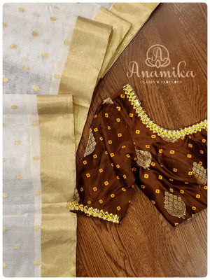 Cream Chanderi Pattu saree with brown bandini blouse