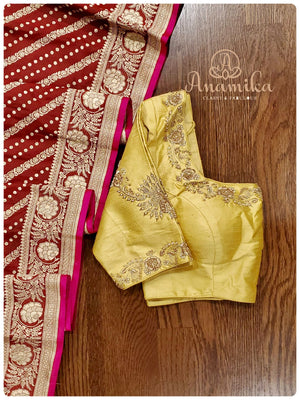 Maroon Banarasi silk saree with a gold work blouse