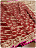 Maroon Banarasi silk saree with a gold work blouse