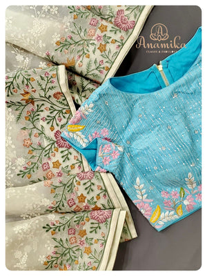 Off white Organza saree with a blue designer work blouse