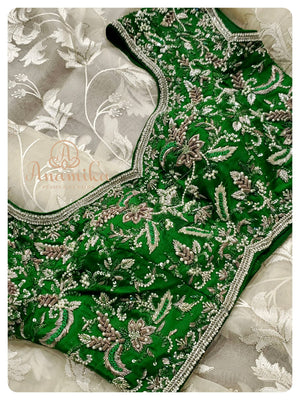 Cream Organza saree with Green heavy work blouse