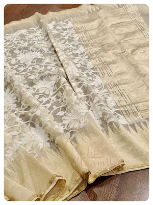 Cream Kora saree with orange ikkat blouse