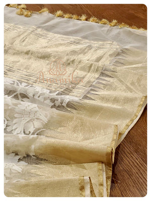 Cream Kora saree with orange ikkat blouse