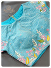 Off white Organza saree with a blue designer work blouse