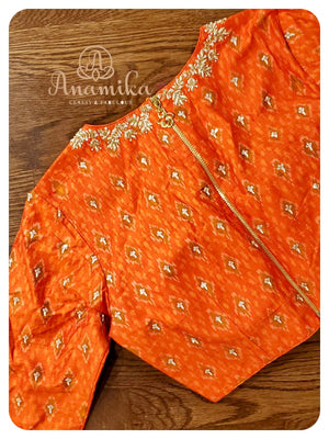 Cream Kora saree with orange ikkat blouse