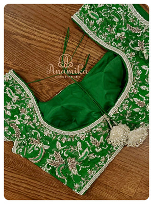 Cream Organza saree with Green heavy work blouse