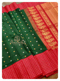 Dark green Gadwal silk saree with red handwork blouse