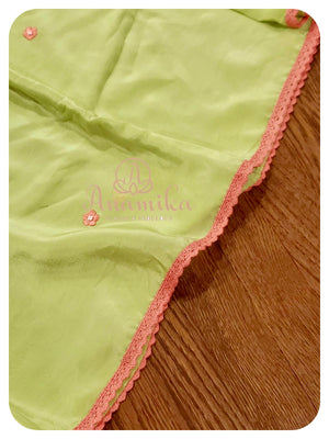 Lime Green crepe saree with peach ruffle blouse