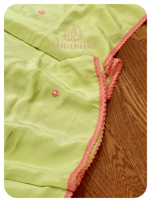 Lime Green crepe saree with peach ruffle blouse