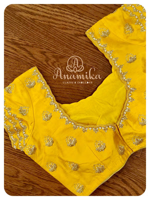 Pink Bandini Gharchola with a yellow blouse